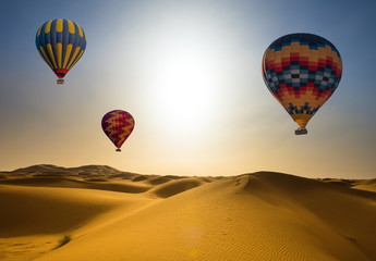 Naklejka premium Desert and hot air balloon Landscape at Sunrise.