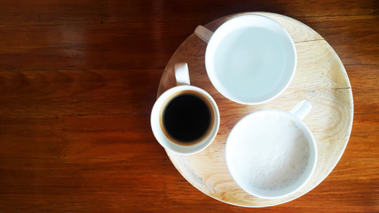 Espresso Hot Coffee and milk short and hot water on wood table