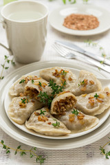 Dumplings with buckwheat porridge and fried onions. This is a very popular food in Poland