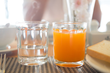 Glass of water and orange juice