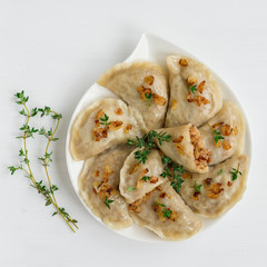 Dumplings with buckwheat porridge and fried onions. This is a very popular food in Poland