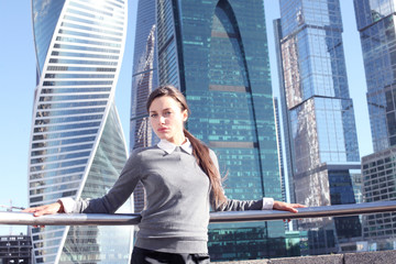 Businesswoman at skyscraper background