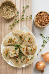 Dumplings with buckwheat porridge and fried onions. This is a very popular food in Poland