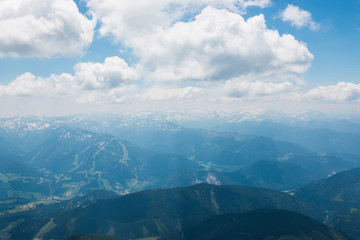 On peak of Dachstein and view alpine mountains