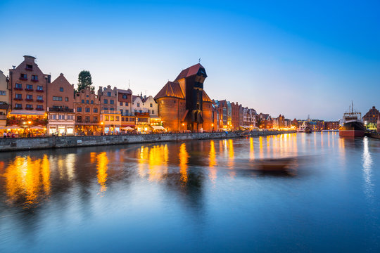 Old town of Gdansk reflected in Motlawa river at dusk, Poland
