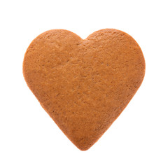 Baked gingerbread from shortbread in the form of a heart. Isolated on white background. Attribute of Valentine's Day