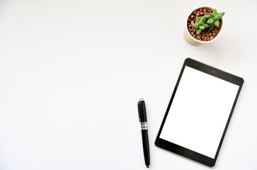 Top view tablet,smartphone ,mouse and keyboard on office desk.Top view with copy space