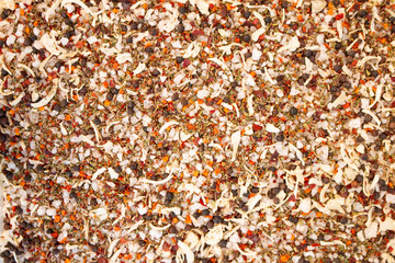 Texture of spices mix and sea salt close-up, spice or seasoning as background. Black Pepper, Sea salt, Pepper flakes, Chilli pepper, Oregano, Thyme, Dried onion.