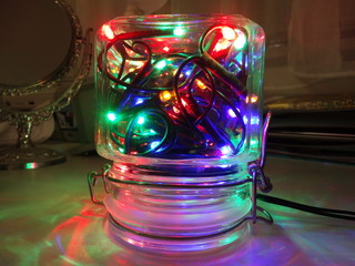 Fototapeta na wymiar Christmas Tree Lights in a Jar