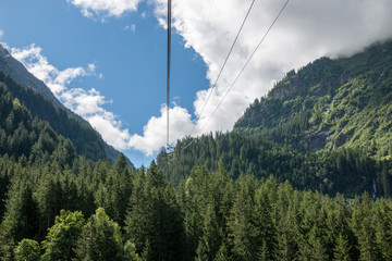 Closeup mountains scenes, cable car to Trift Bridge in national park Switzerland