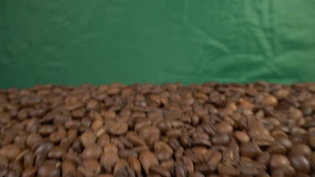 Fried of coffee beans on green screen slider shot close-up 4k apple prores 10bit