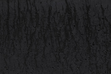 Black concrete wall with stains. Grunge background, texture.