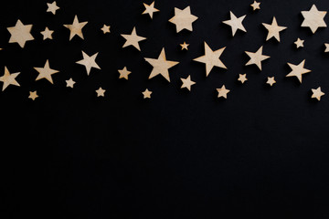 Wooden stars on a black background. Chalk board. Postcard. Dad's day concept. Night.