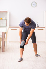 Man exercising for knee injury recovery