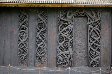 Wooden carvings on a wall of Urnes Stave Church Ornes Luster Sogn og Fjordane  Norway Scandanavia