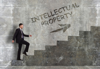 Business, technology, internet and networking concept. A young entrepreneur goes up the career ladder: Intellectual property