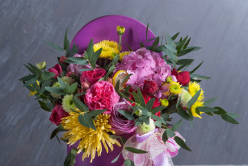 bouqet of flowers in box. No toned with natural color. Colored flowers. Selective focus, macro