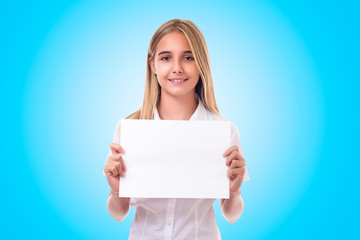 teen girl in white shirt  holding advertising sign board. ,isolated over blue background