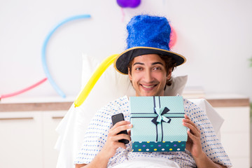 Young man celebrating his birthday in hospital