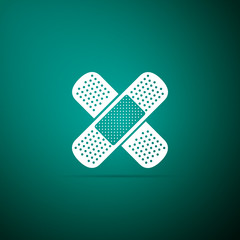 Bandage plaster icon isolated on green background. Medical plaster, adhesive bandage, flexible fabric bandage. Flat design. Vector Illustration
