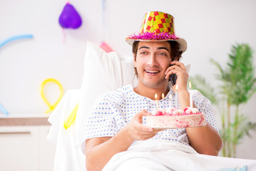 Young man celebrating his birthday in hospital