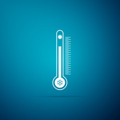 Thermometer with scale measuring heat and cold, with sun and snowflake icon isolated on blue background. Flat design. Vector Illustration