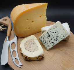 cheese selection on wooden rustic board. Various types of international cheese, blue mold, gouda, gorgonzola . top view - Image. 