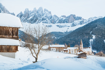 Dolomites mountain peaks with Val di Funes village in winter, South Tyrol, Italy