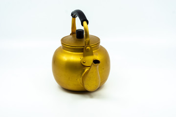 Gold teapot or kettle isolated on white background