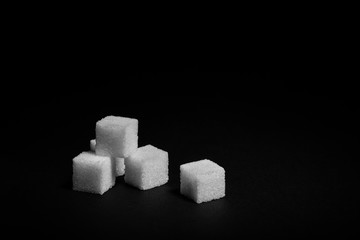 Sugar cubes on a black background