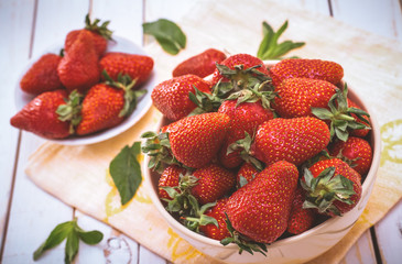 Ripe strawberry on wooden table closeup shot