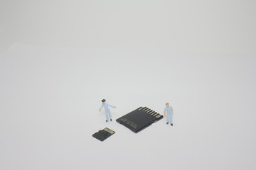 a mini Worker working on micro sd card.