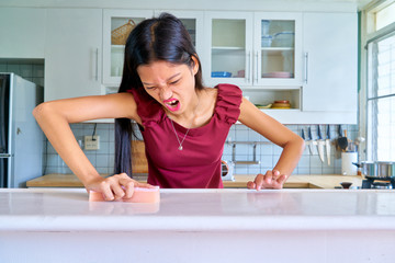 Beautiful woman posing - angry  woman trying to cleanse the stain