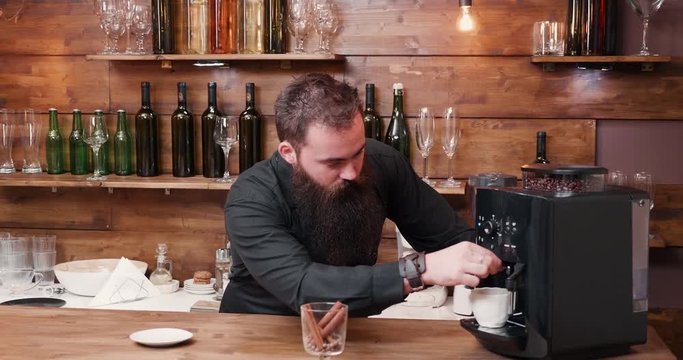 The Perfect Coffee stock video is an awesome piece of footage that displays a bartender making the perfecrt cup of coffee using a state of the art coffee maker. We can also see a glass full of