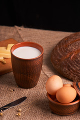 organic dairy products - milk, cheese, and also eggs, bread. on table