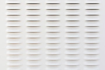 Old white metal plates with ventilation holes on  Telephone signal pole.