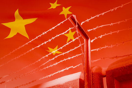The barbed wire on the background of 3D illustration of the developing Chinese flag.