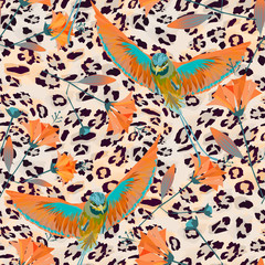 Seamless pattern with birds of Paradise on Jaguar skin background.