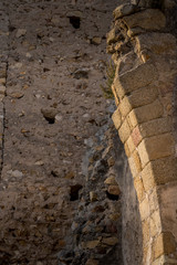 View of Palafolls castle medieval ruined stronghold between Girona and Barcelona on the Costa Brava with the Catalan flag proudly flying over the Romanesque church