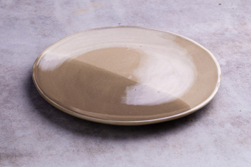 Empty blank ceramic dish on white background