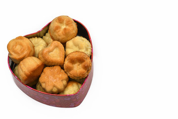 Isolate. Valentine's day. The heart-shaped box has a lot of cupcakes, cookies. Horizontal photography.