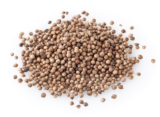 Heap of dried coriander seeds isolated on white background