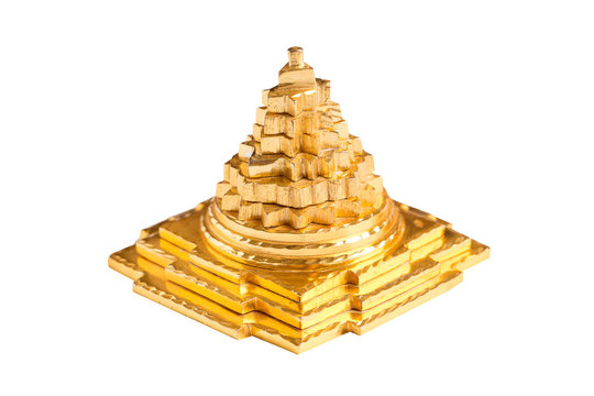The sacred pyramid of Meru Chakra on a white background. Golden pyramid closeup isolate on white background. Meru Chakra.