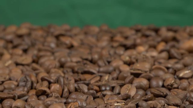 Fried of coffee beans on green screen slider shot close-up 4k apple prores 10bit