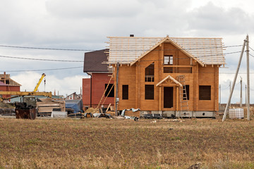Fototapeta na wymiar Construction of a wooden house
