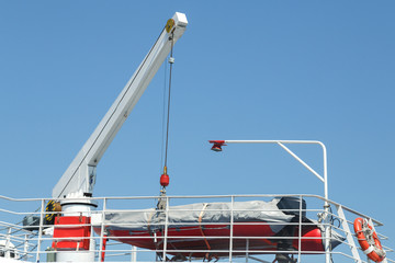 A fragment of a large white ship in the sea.