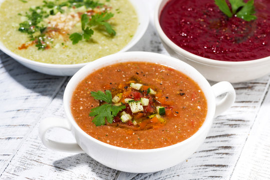 cold vegetable soups in assortment on white table