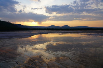 Sunset fumes over the Grand Prismatic pool in Yellowstone National Park, United States