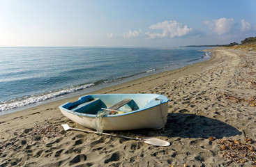 beach and small boat in the  eastern coast of Corsica