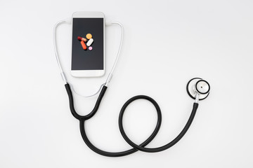 Fototapeta na wymiar Telemedicine. Smartphone and stethoscope, Health care, medicine, hospital